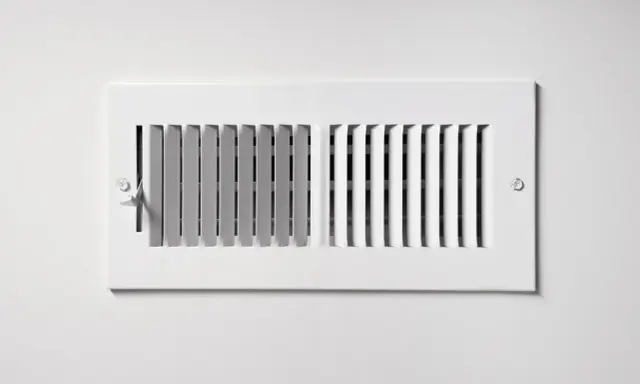 Grille de ventilation blanche, partie intégrante d'une installation pompe à chaleur air air gainable, pour une diffusion discrète de l'air.