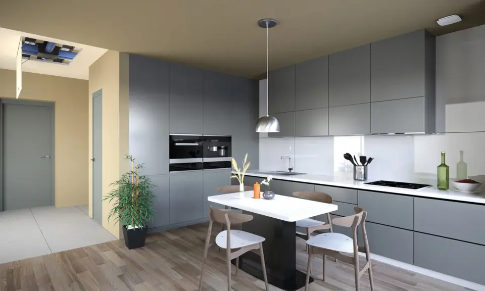 Cuisine moderne avec îlot central. Un système hygro A ou B est visible au plafond, assurant une ventilation optimale.
